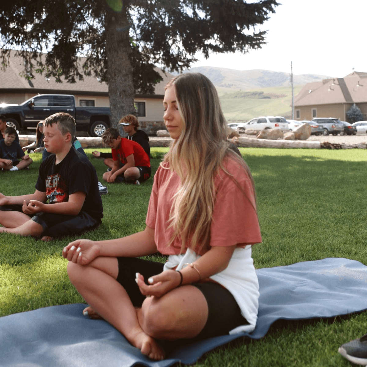 Campers meditating